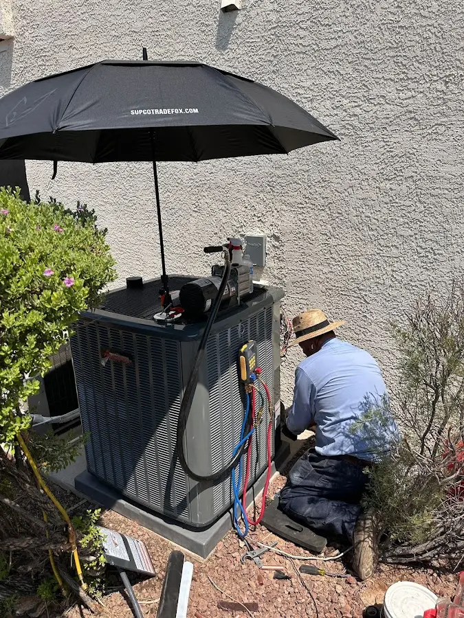 HVAC technician performing outdoor AC maintenance in Mabank